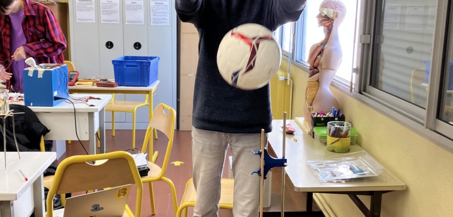 Grade 12 student measuring the rebound height of an inflated ball