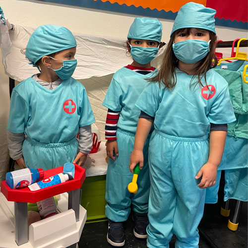 3 students dressed as surgeons