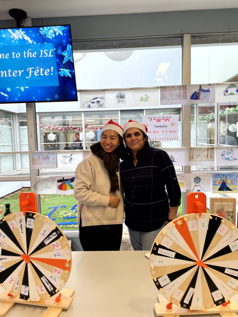 Two parents wearing Santa hats