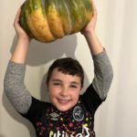 boy holding a pumpkin