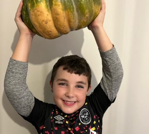 boy holding a pumpkin