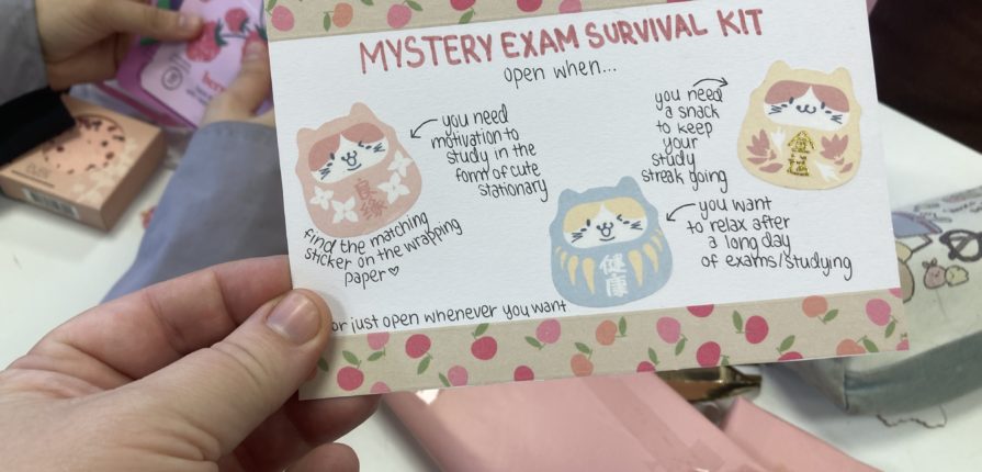 Card with "Mystery Exam Survival Kit" written on it