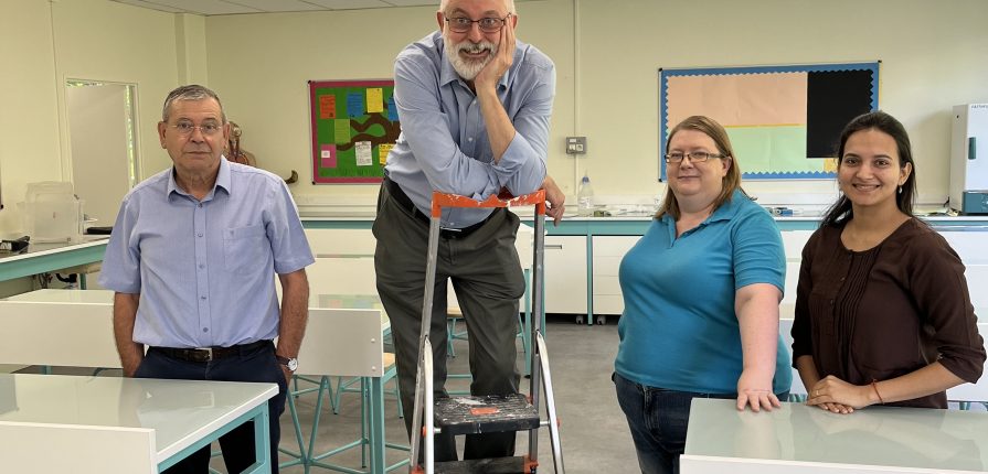 Science teachers posing in the newly renovated science lab