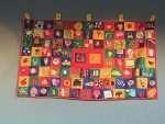 ISL 20th anniversary quilt hanging on a wall
