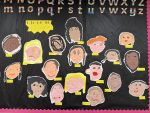 Paper self portraits on a black background