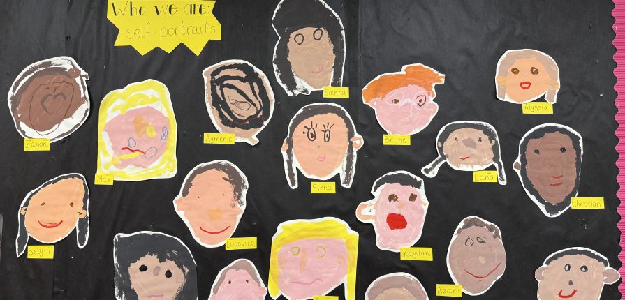 Paper self portraits on a black background
