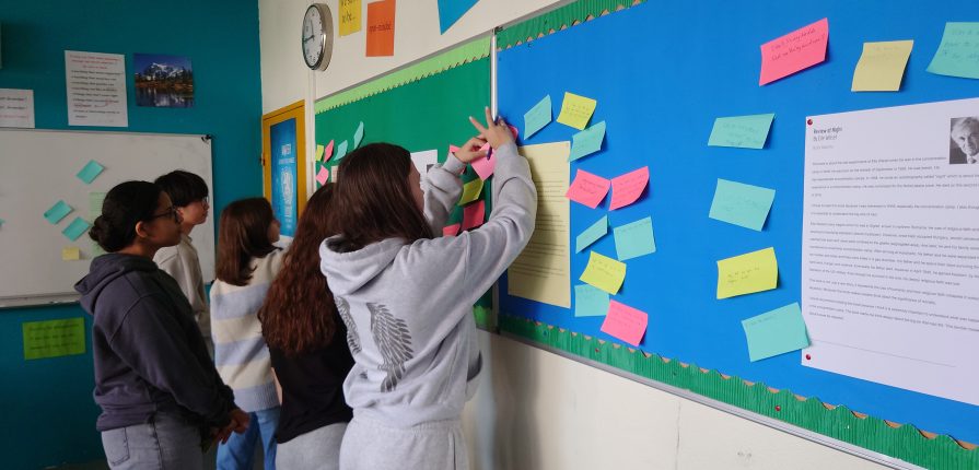 Students writing feedback to their classmates' autobiographies