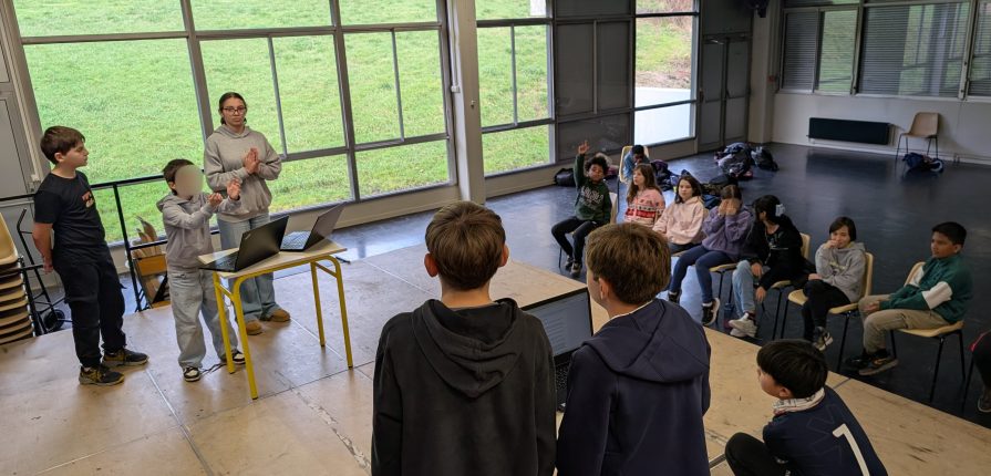 Grade 6 students on a stage during their debate